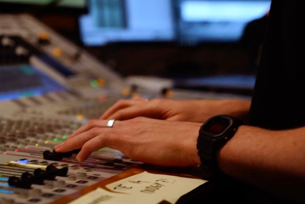 Student using Studer mixing console in Studio 1